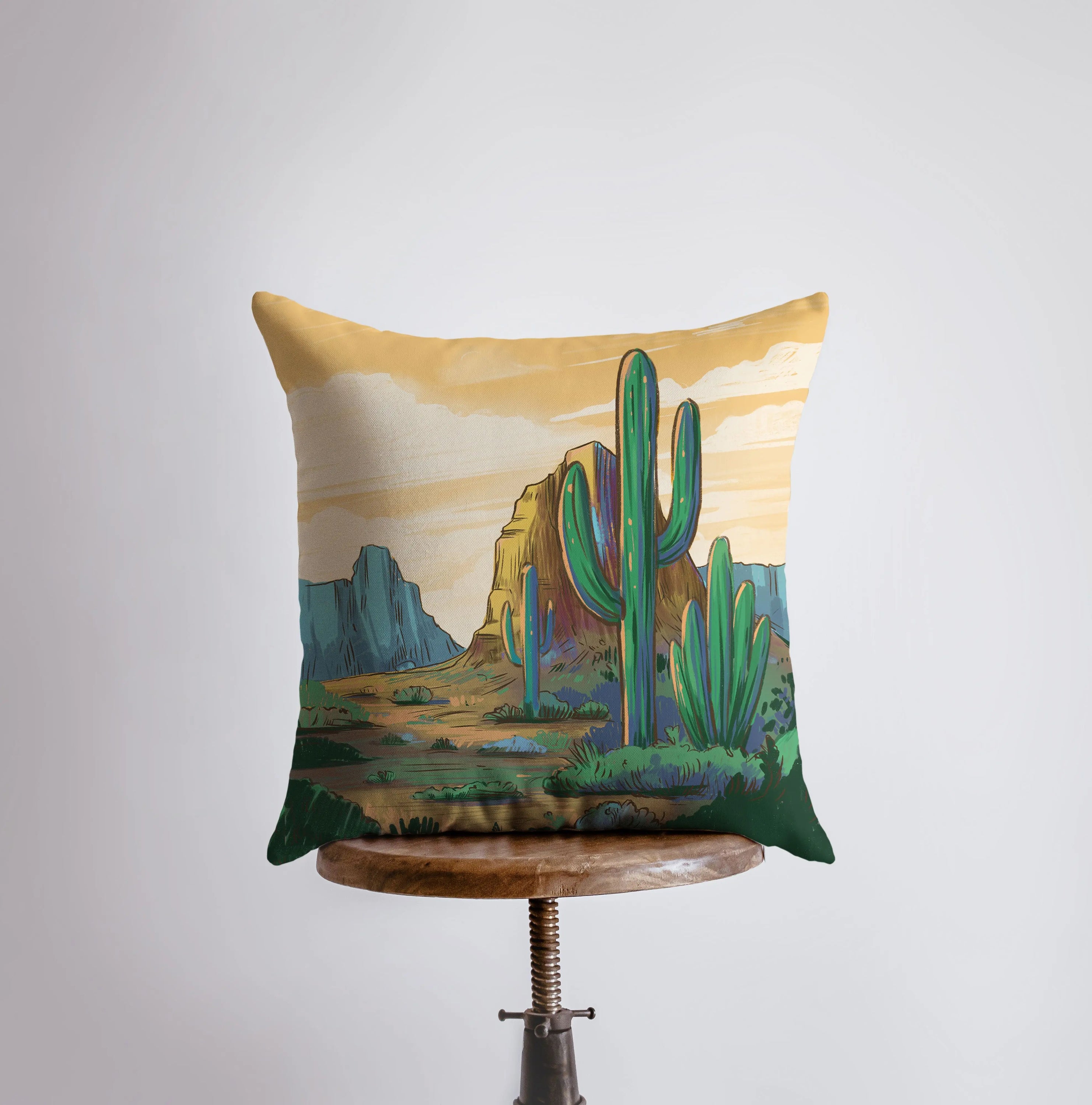 Arizona landscape pillow featuring sunrise and sunset scenes, showcasing vibrant colors and a concealed zipper.