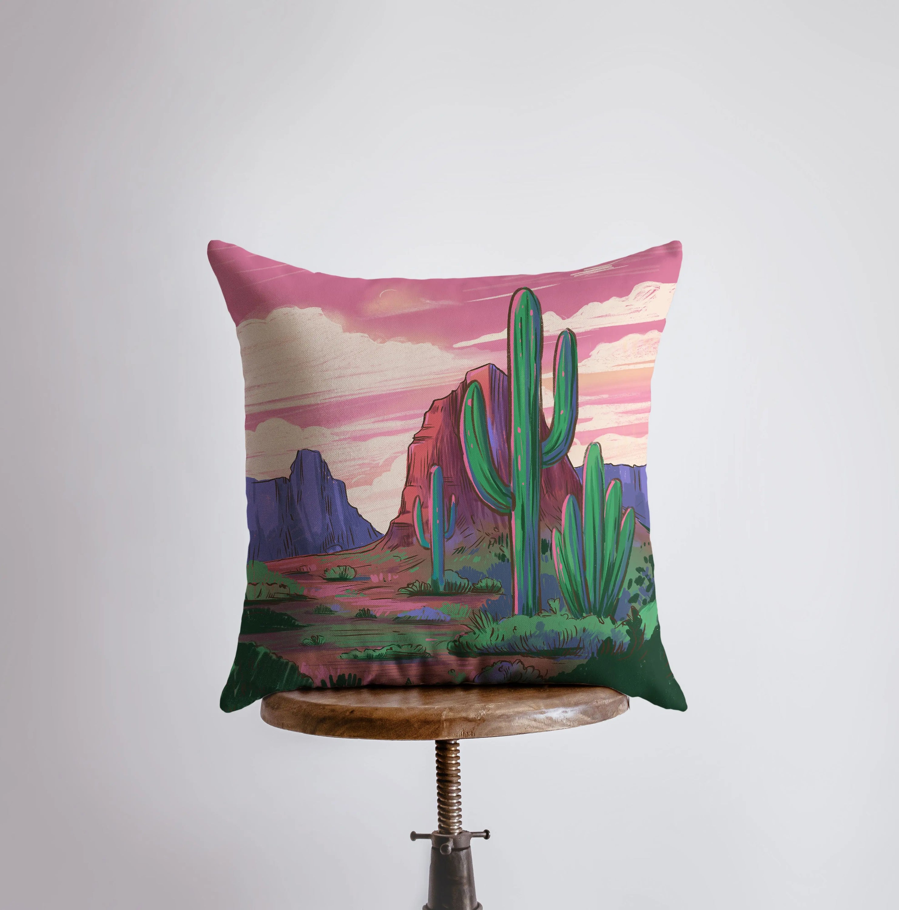 Arizona landscape pillow featuring sunrise and sunset scenes, showcasing vibrant colors and a concealed zipper.