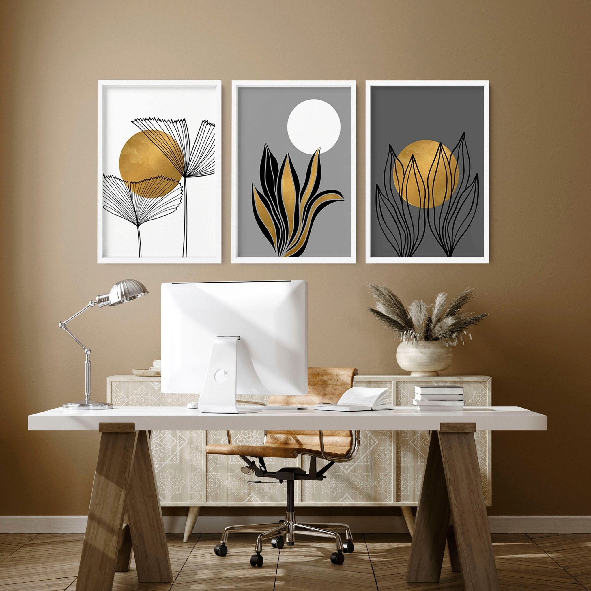 Set of 3 modern botanical wall art prints in grey, gold, and black tones, designed for office desk decor.