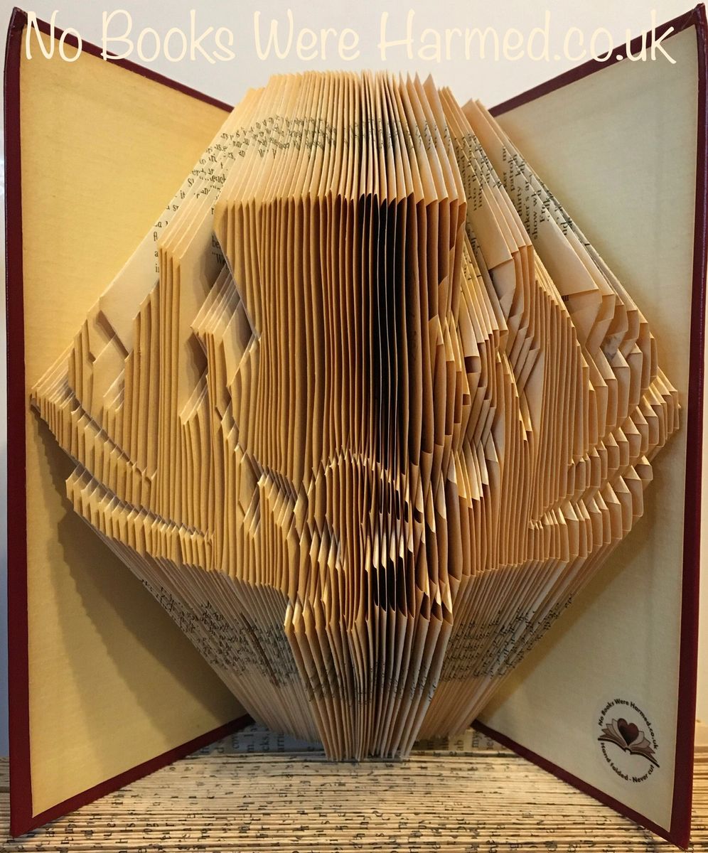 A beautifully crafted Detailed Scottish Thistle made from hand-folded pages of vintage books, showcasing intricate details and unique colors.