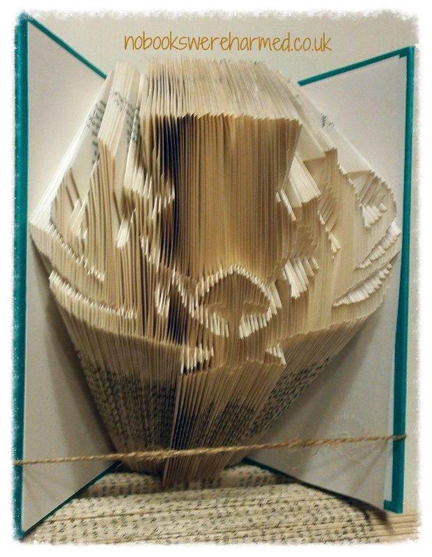 A beautifully crafted Detailed Scottish Thistle made from hand-folded pages of vintage books, showcasing intricate details and unique colors.