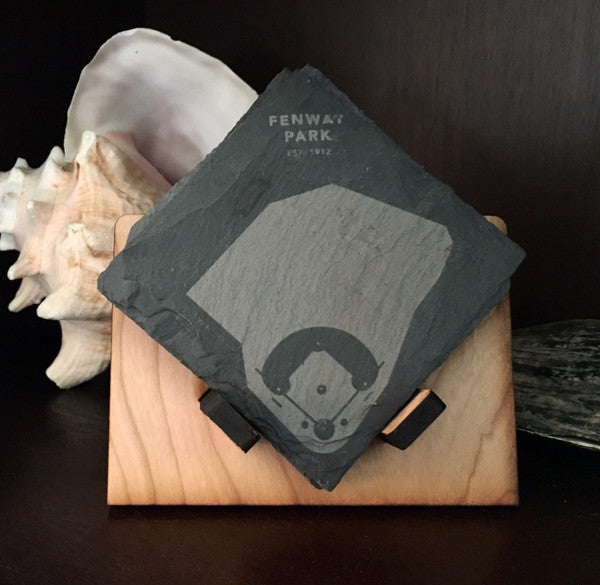 A set of four diamond slate coasters with a cherry wood holder, showcasing their natural stone texture and elegant design.