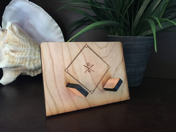 A set of four diamond slate coasters with a cherry wood holder, showcasing their natural stone texture and elegant design.