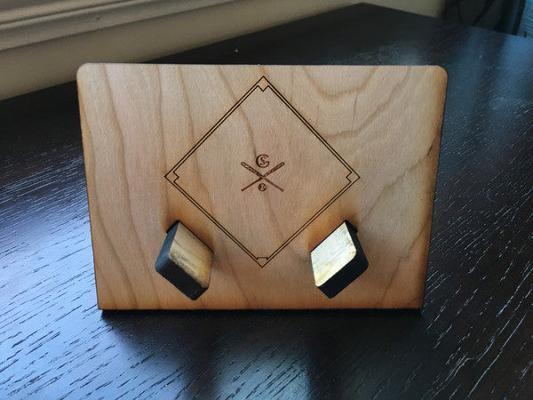 A set of four diamond slate coasters with a cherry wood holder, showcasing their natural stone texture and elegant design.