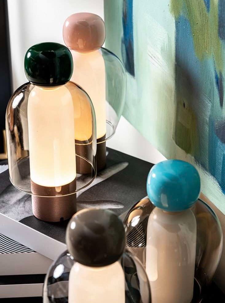 Dimmable Portable Cute Whimsy Eclectic Modern Table Lamp with rounded glass shape and metal base, showcasing a playful design.