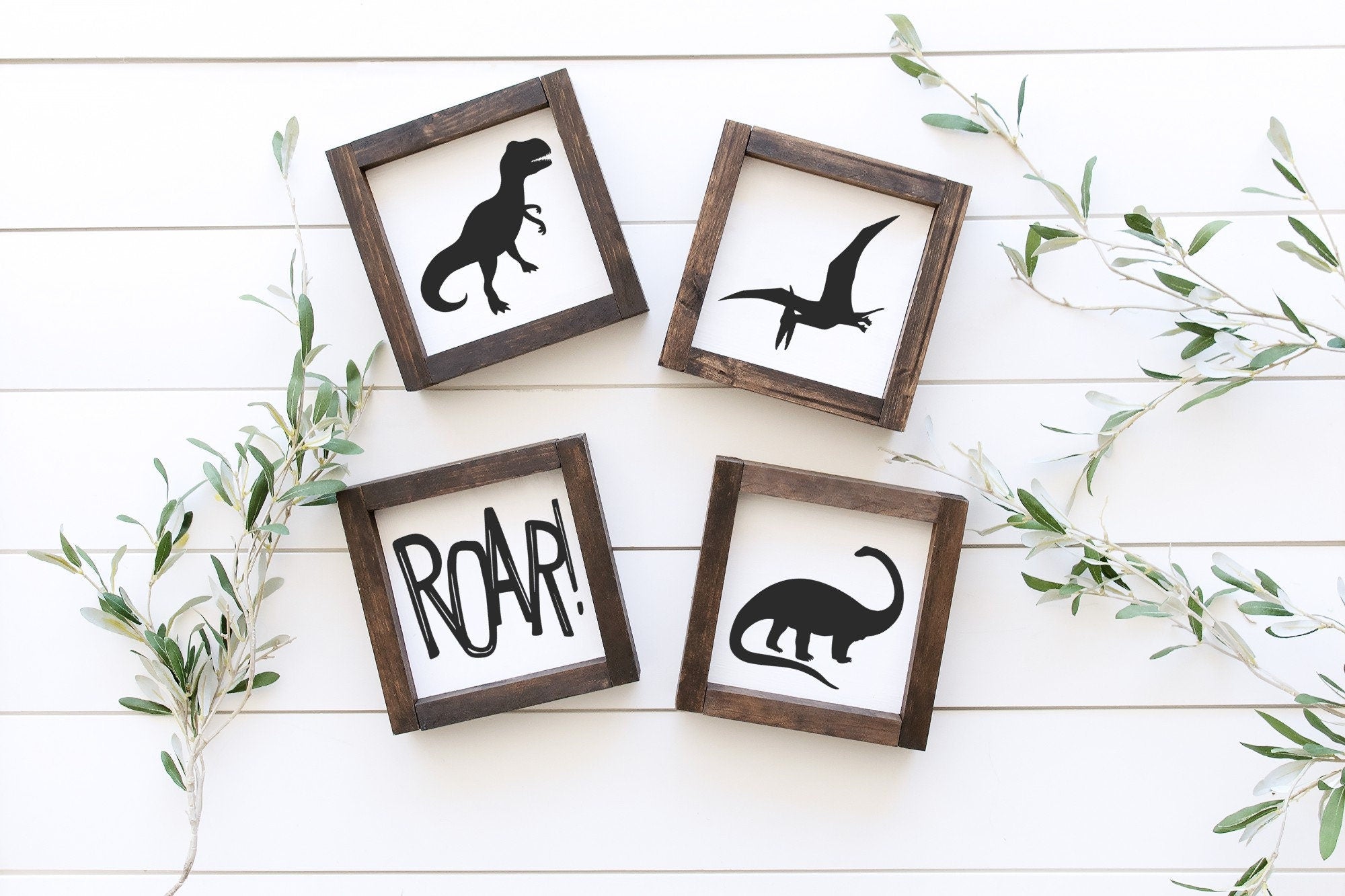 Handmade Dinosaur Wood Signs in matte white finish, showcasing unique wood grain and knots, available in two sizes.