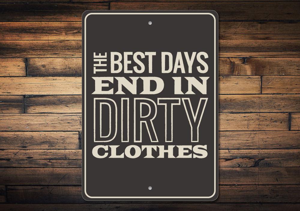 A decorative Dirty Clothes Sign made of aluminum, featuring humorous text and pre-drilled holes for easy mounting.