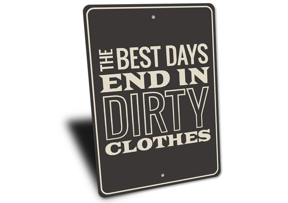 A decorative Dirty Clothes Sign made of aluminum, featuring humorous text and pre-drilled holes for easy mounting.