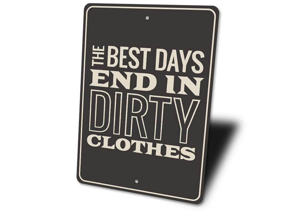 A decorative Dirty Clothes Sign made of aluminum, featuring humorous text and pre-drilled holes for easy mounting.