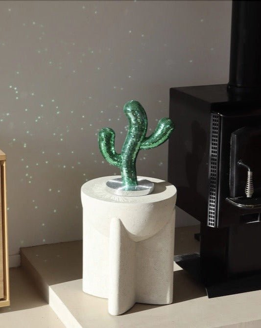 A whimsical Disco Dancing Cactus decor piece, featuring a cute cactus design that dances and shines, perfect for adding fun to any space.