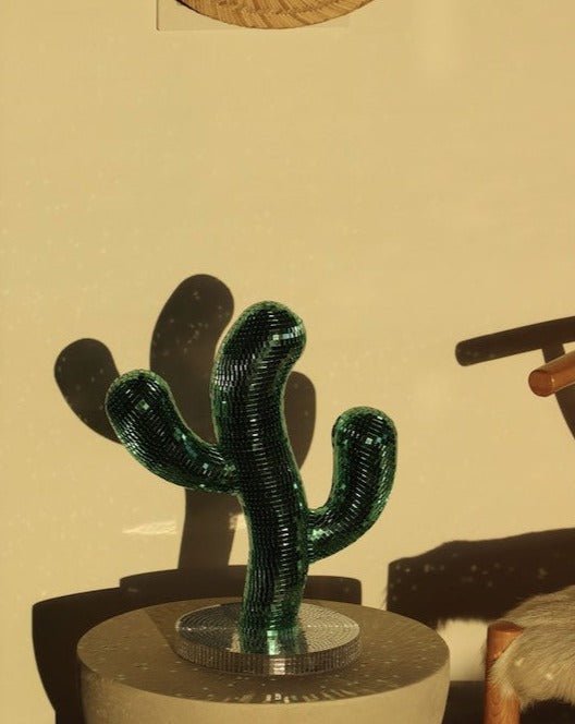 A whimsical Disco Dancing Cactus decor piece, featuring a cute cactus design that dances and shines, perfect for adding fun to any space.