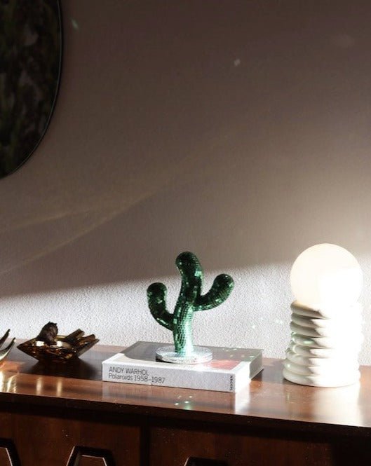 A whimsical Disco Dancing Cactus decor piece, featuring a cute cactus design that dances and shines, perfect for adding fun to any space.