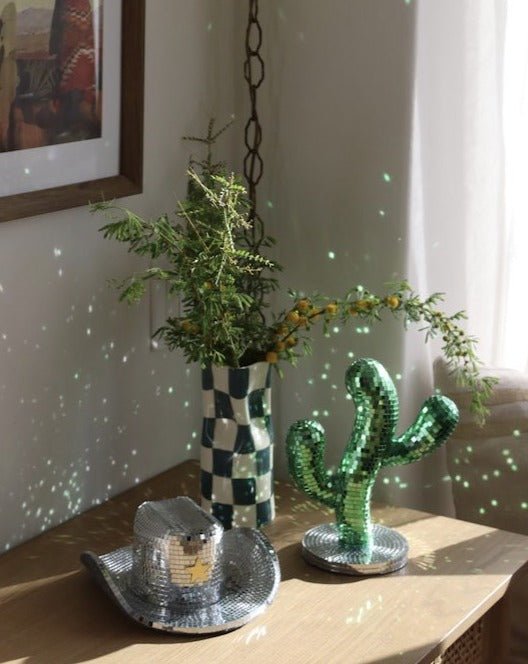 A whimsical Disco Dancing Cactus decor piece, featuring a cute cactus design that dances and shines, perfect for adding fun to any space.