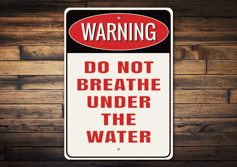 A decorative 'Do Not Breathe Under the Water' sign made of high-quality aluminum, featuring a bold design suitable for indoor or outdoor use.