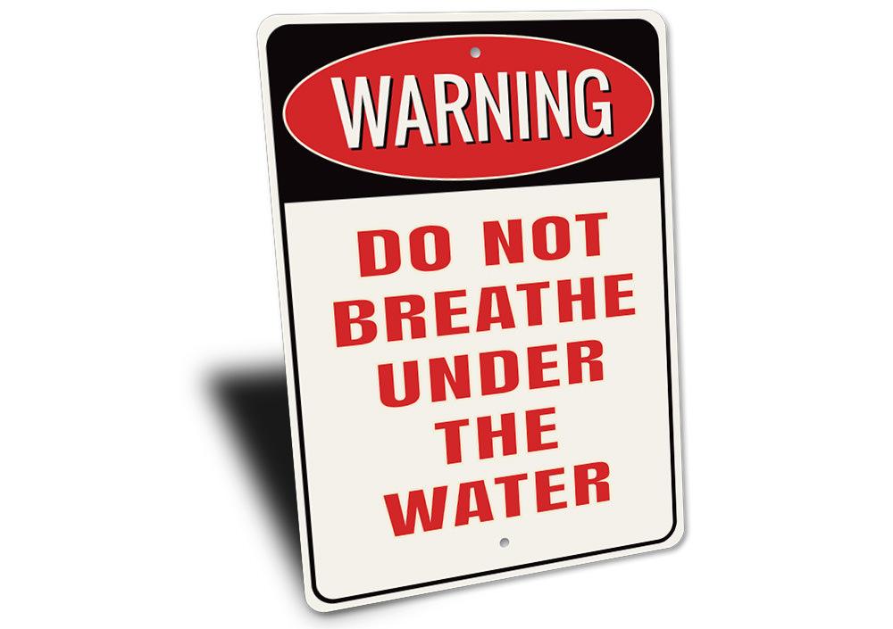 A decorative 'Do Not Breathe Under the Water' sign made of high-quality aluminum, featuring a bold design suitable for indoor or outdoor use.