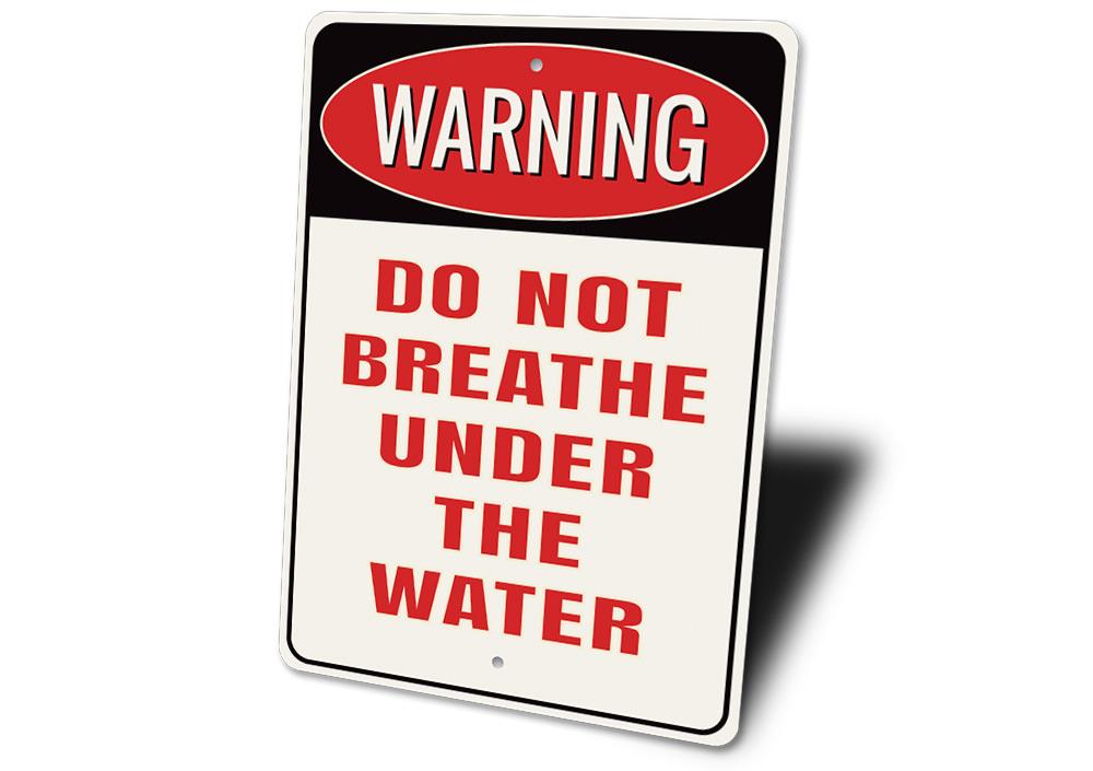 A decorative 'Do Not Breathe Under the Water' sign made of high-quality aluminum, featuring a bold design suitable for indoor or outdoor use.