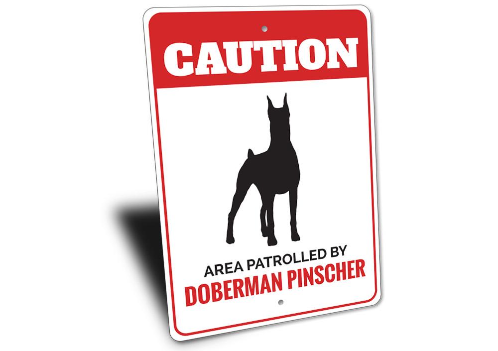 A decorative Doberman Pinscher sign made of high-quality aluminum, featuring a customizable design, perfect for home decor.