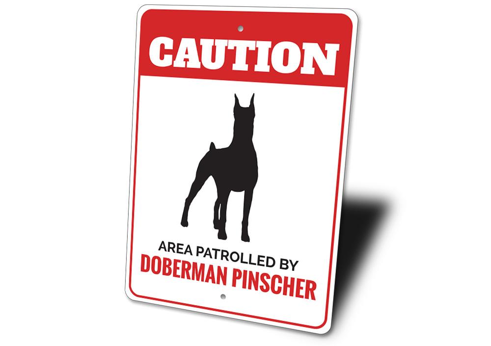 A decorative Doberman Pinscher sign made of high-quality aluminum, featuring a customizable design, perfect for home decor.