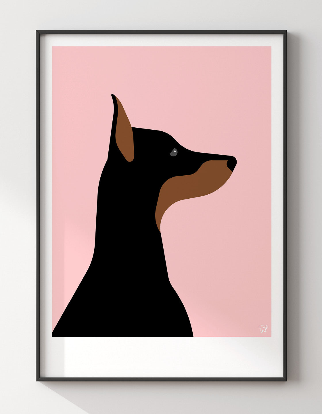 A playful Doberman named Dina, showcasing her sleek coat and friendly demeanor.