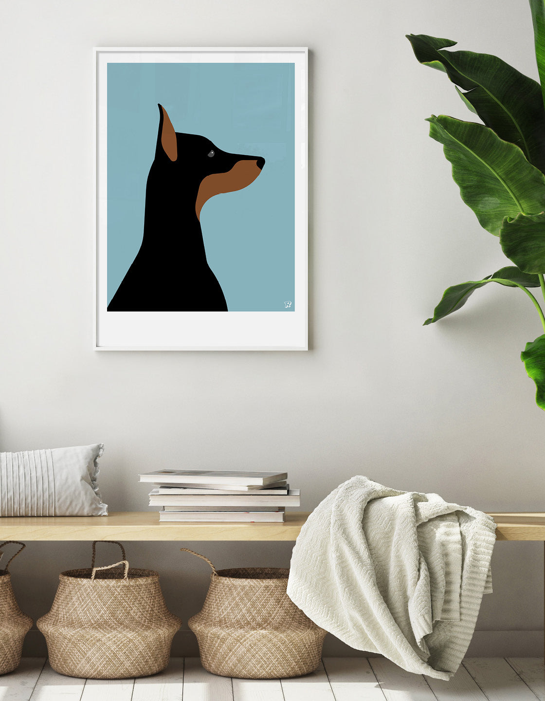 A playful Doberman named Dina, showcasing her sleek coat and friendly demeanor.