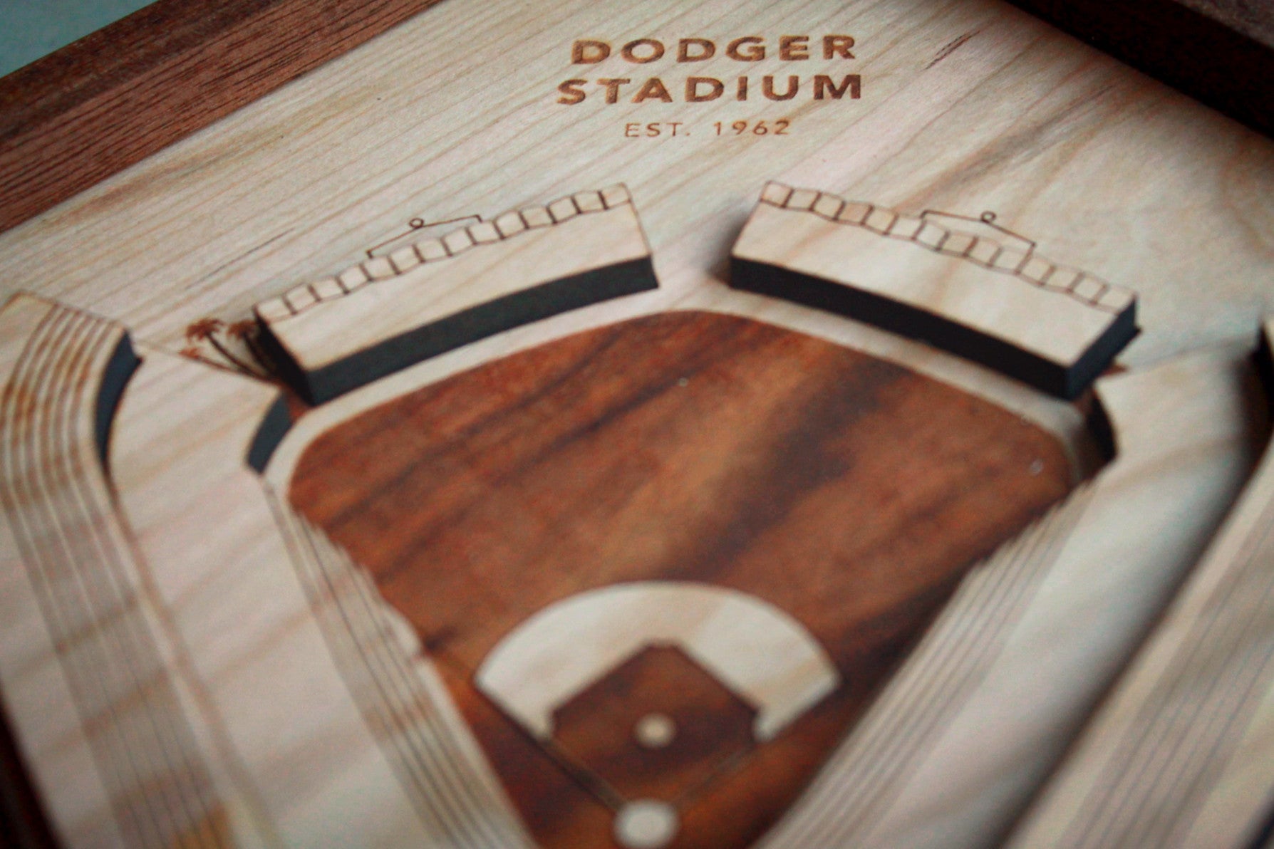 A detailed wooden replica of Dodger Stadium featuring palm trees and a black walnut frame, perfect for Dodgers fans.