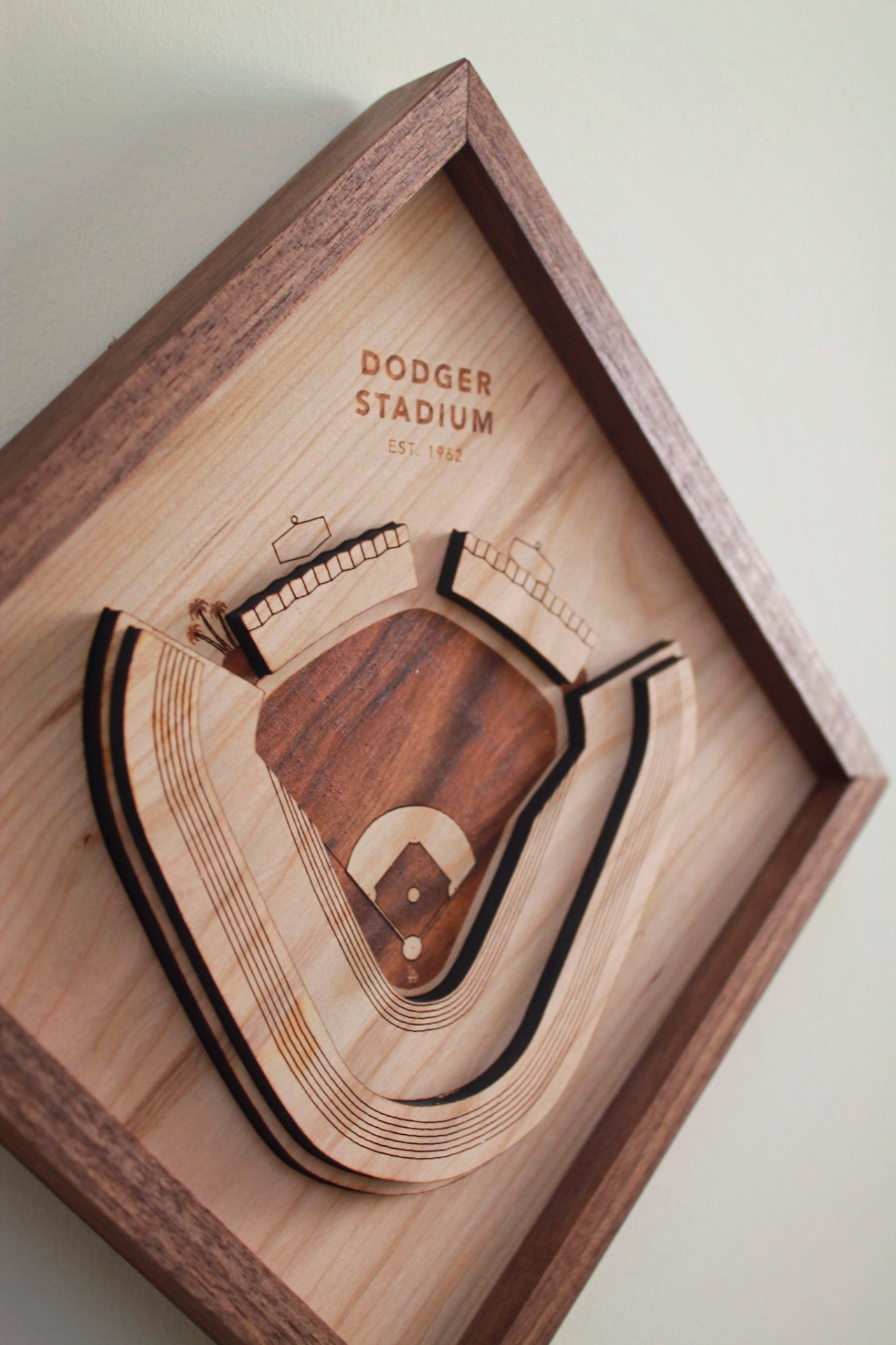 A detailed wooden replica of Dodger Stadium featuring palm trees and a black walnut frame, perfect for Dodgers fans.