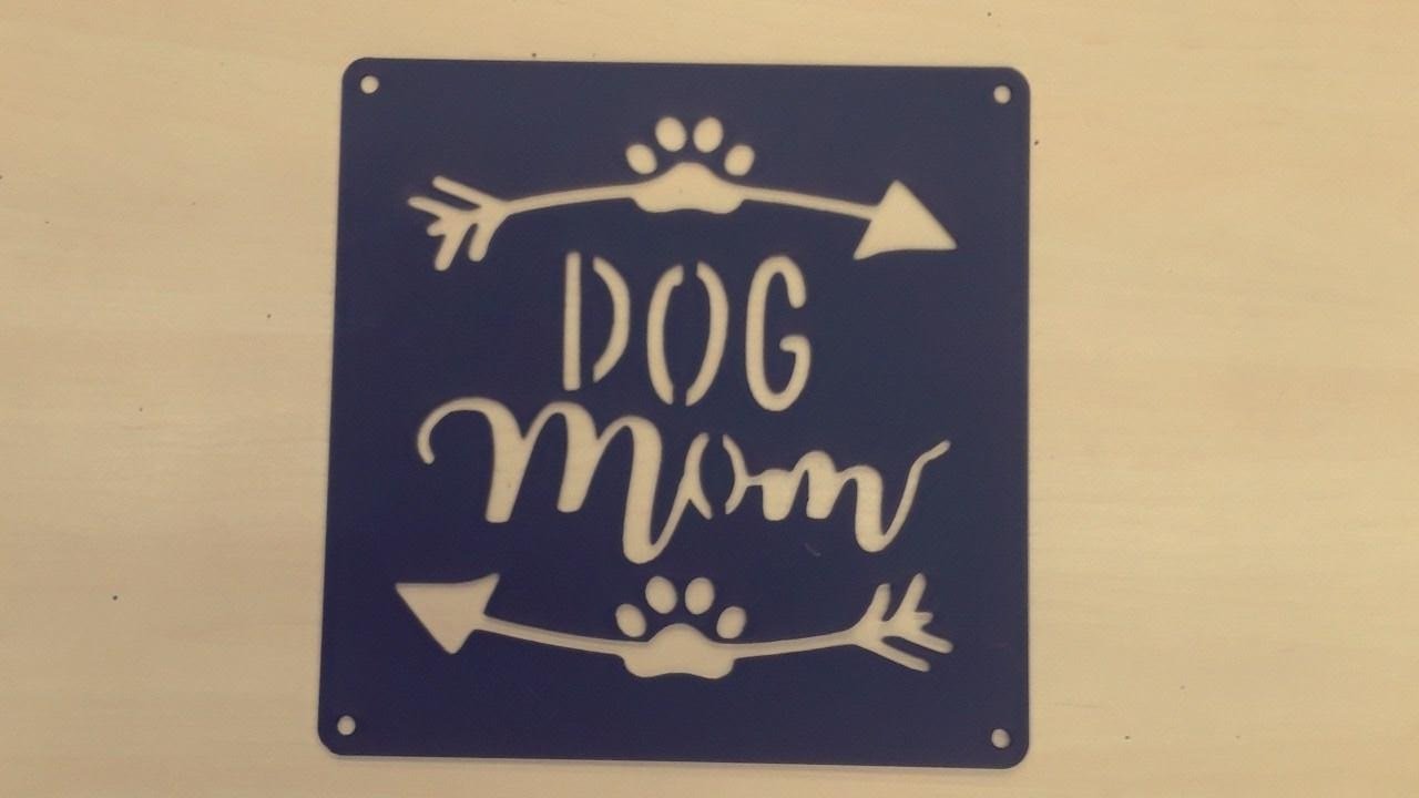 Stylish black metal wall art featuring the words 'Dog Mom', perfect for home decor.