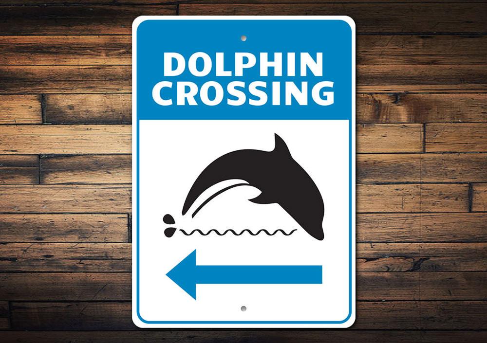 Dolphin Crossing Sign made of aluminum, featuring vibrant colors and a beach-themed design, perfect for coastal decor.