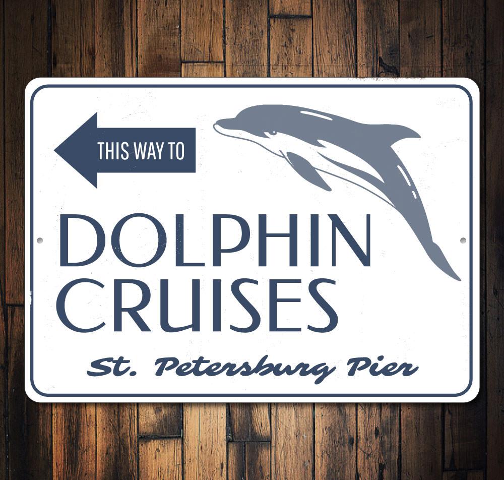 Dolphin Cruises This Way Sign made of aluminum, featuring vibrant colors and customizable text, perfect for beach-themed decor.