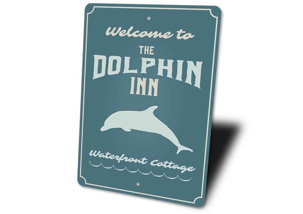 Dolphin Inn Sign featuring vibrant coastal design, made from high-quality aluminum, perfect for beach-themed decor.