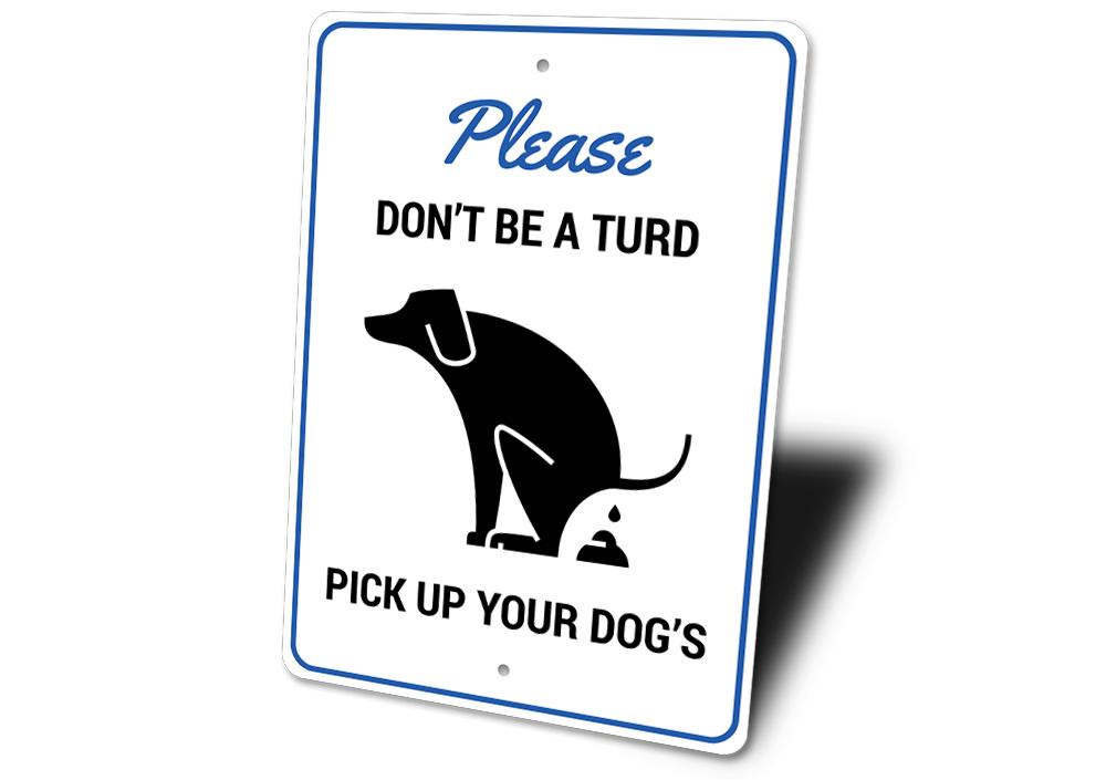 A humorous 'Don't Be a Turd' decorative sign made of aluminum, featuring a playful design suitable for home decor.