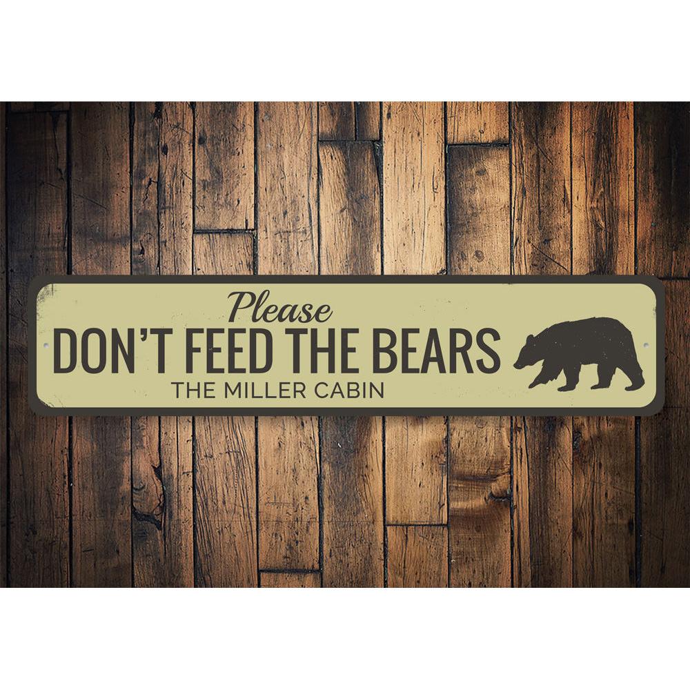 A decorative 'Don't Feed Bears' sign made of high-quality aluminum, featuring a rustic design suitable for lakehouse decor.