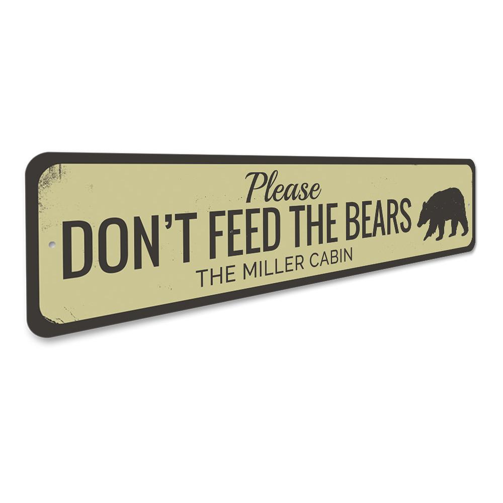 A decorative 'Don't Feed Bears' sign made of high-quality aluminum, featuring a rustic design suitable for lakehouse decor.