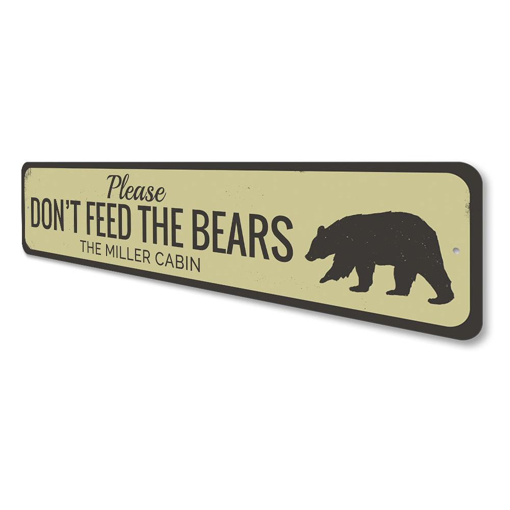 A decorative 'Don't Feed Bears' sign made of high-quality aluminum, featuring a rustic design suitable for lakehouse decor.