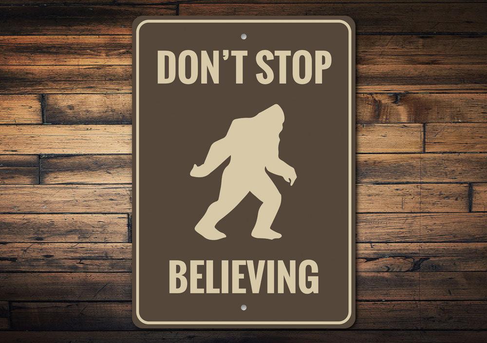 Dont Stop Believing Bigfoot Sign made of aluminum, featuring a whimsical design perfect for home decor.