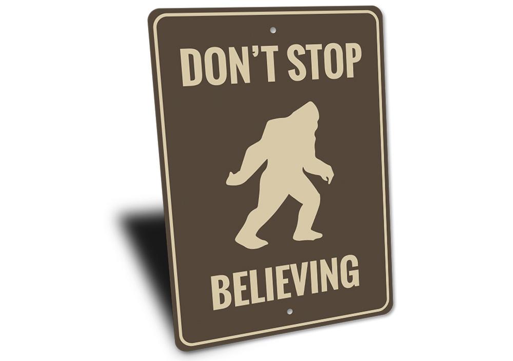 Dont Stop Believing Bigfoot Sign made of aluminum, featuring a whimsical design perfect for home decor.