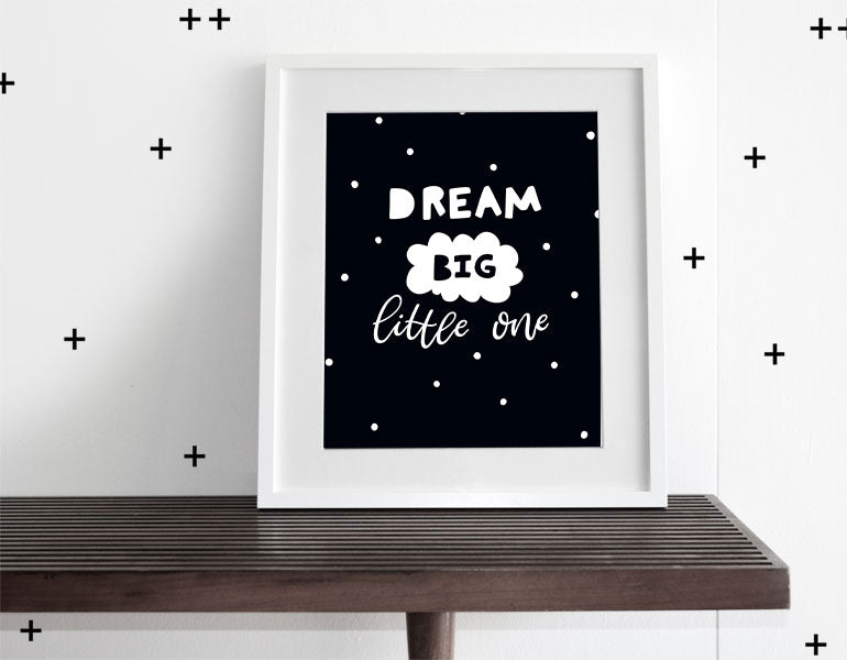 Dream Big Little One Wall Art featuring a motivational quote, designed for modern nurseries, framed with a white matte.