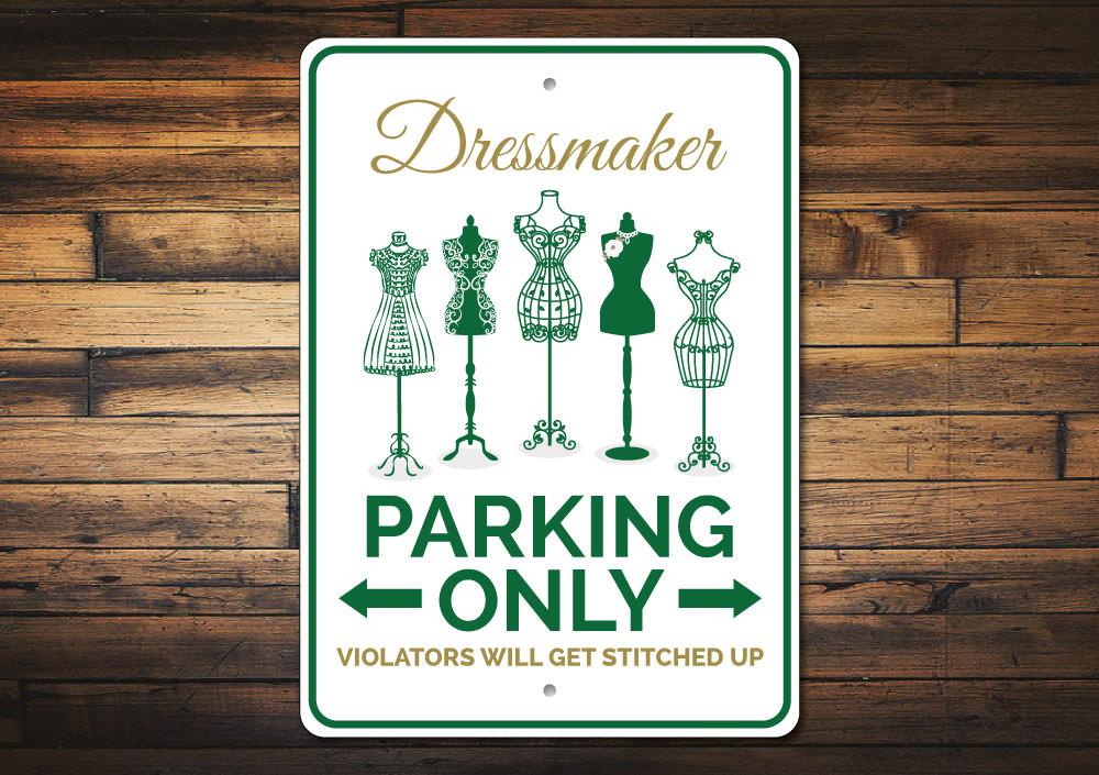 A colorful Dressmaker Parking Sign made of durable aluminum, featuring customizable text and pre-drilled holes for easy mounting.