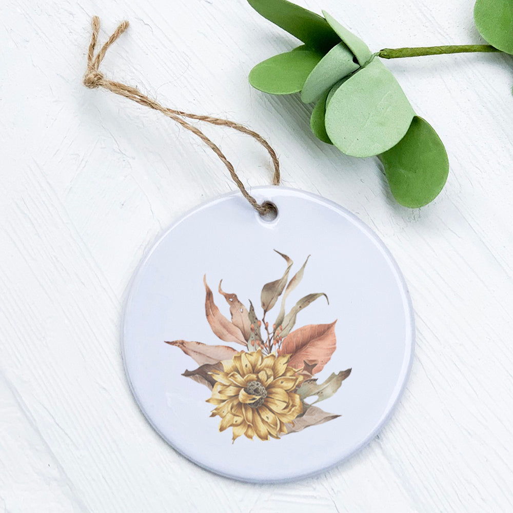 A beautifully crafted porcelain ornament featuring dried harvest flowers, showcasing vibrant colors and a glossy finish.