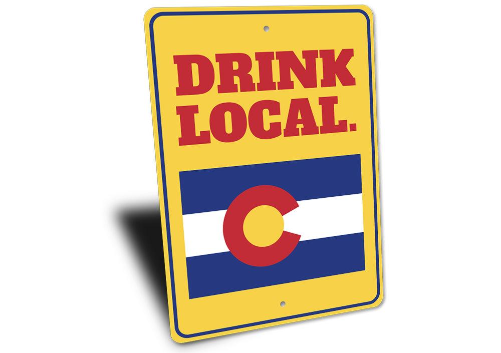 A decorative Drink Local Sign made of high-quality aluminum, featuring customizable text and pre-drilled holes for easy mounting.