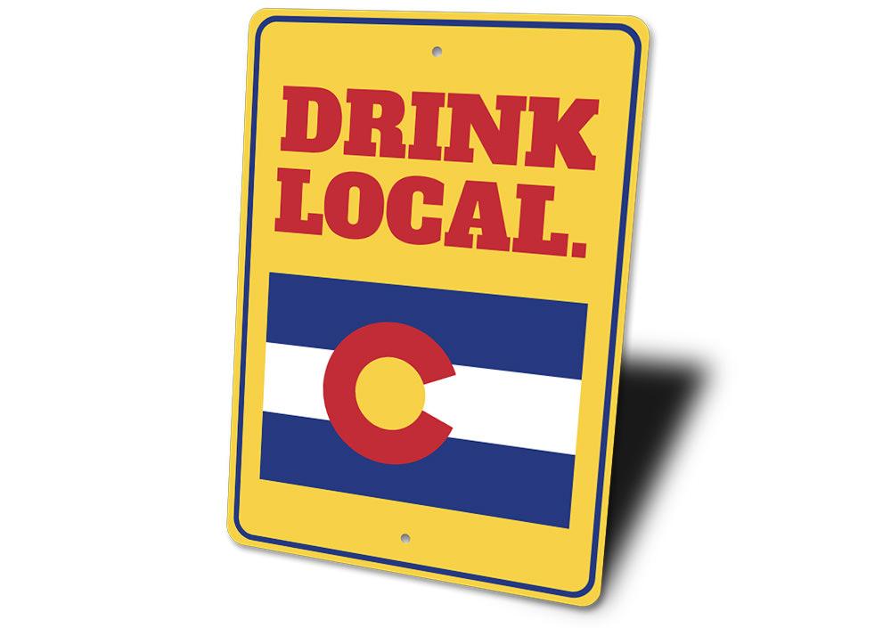 A decorative Drink Local Sign made of high-quality aluminum, featuring customizable text and pre-drilled holes for easy mounting.