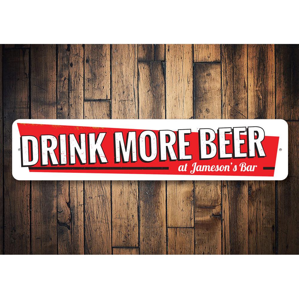 A decorative Drink More Beer Sign made of aluminum, featuring humorous text and a stylish design, perfect for home decor.