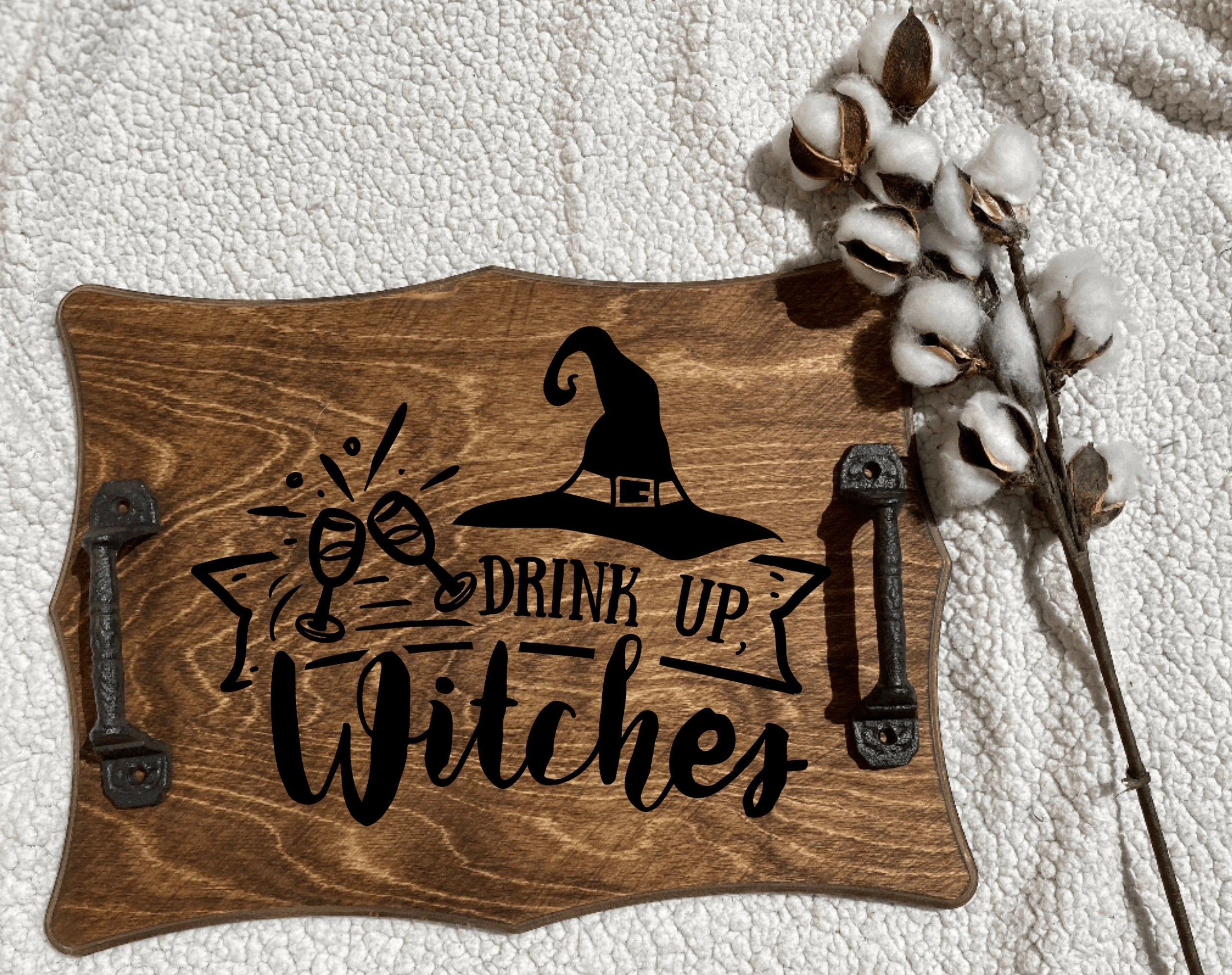 Handmade wooden serving tray with a spooky design, featuring cast iron handles and a rich chestnut stain, perfect for witches and Halloween gatherings.