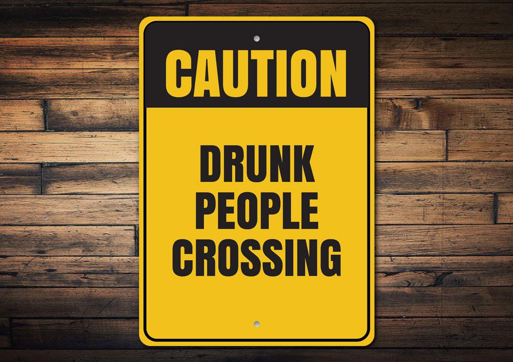 A humorous Drunk People Crossing Sign made of aluminum, featuring a playful design perfect for man caves and home decor.