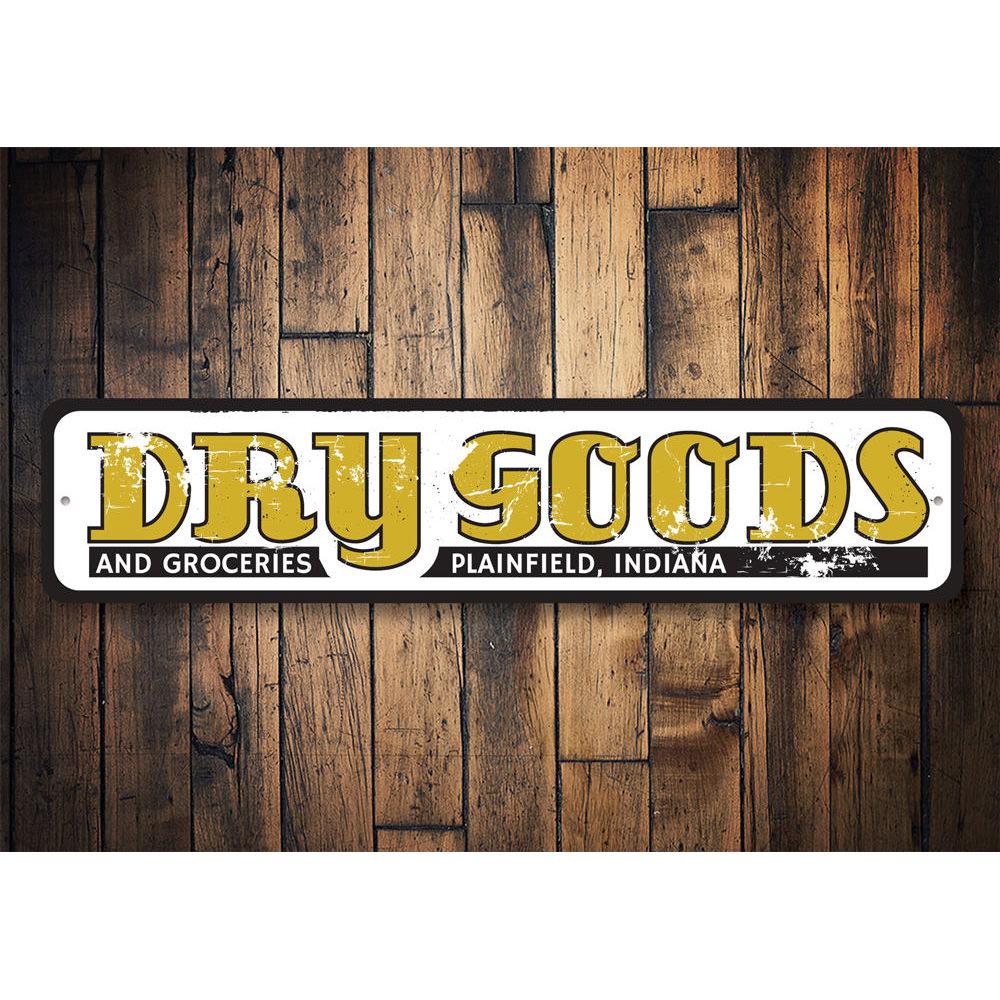 A decorative Dry Goods and Groceries Sign made of high-quality aluminum, featuring customizable text options, ideal for businesses and homes.