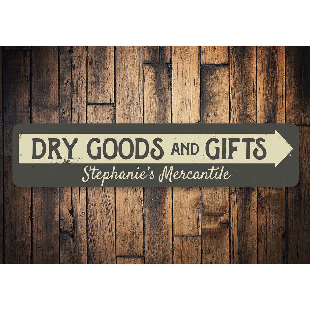 Decorative Dry Goods & Gifts Arrow Sign made of aluminum, featuring a stylish design suitable for businesses and personal gifts.