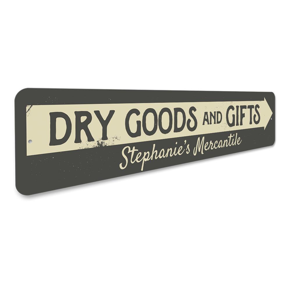 Decorative Dry Goods & Gifts Arrow Sign made of aluminum, featuring a stylish design suitable for businesses and personal gifts.