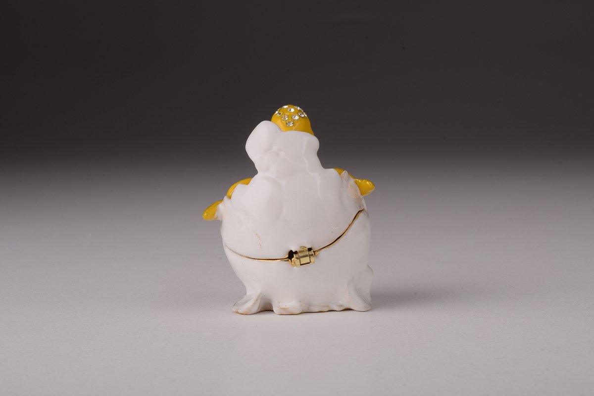 A beautifully crafted Duck trinket box emerging from an eggshell, adorned with Austrian crystals and plated with gold.