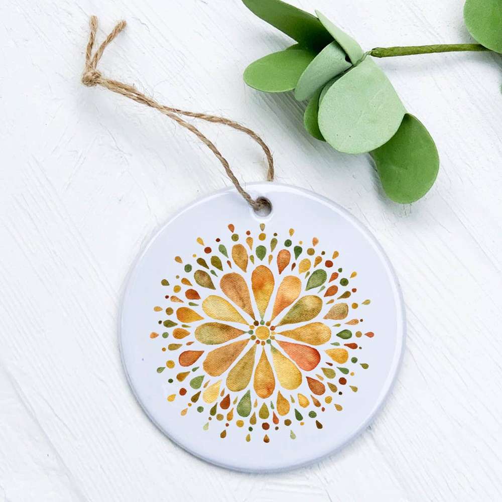 A beautifully crafted Earth Mandala Ornament made of high-quality porcelain, featuring a vibrant mandala design with a smooth, glossy finish.