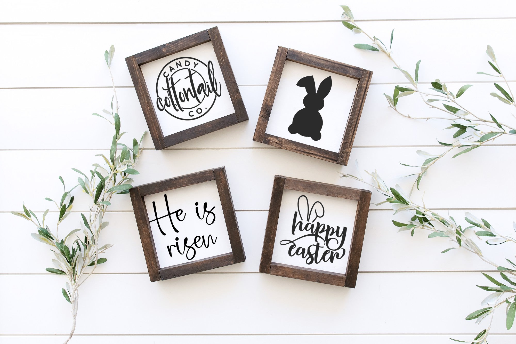 Handmade Easter wood signs in white with painted lettering, available in two sizes, showcasing unique wood grain and knots.